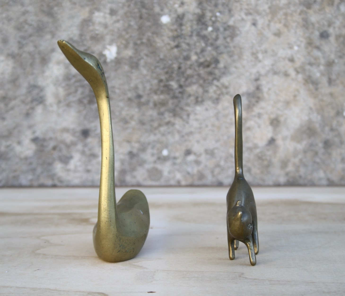 Cat and brass swan