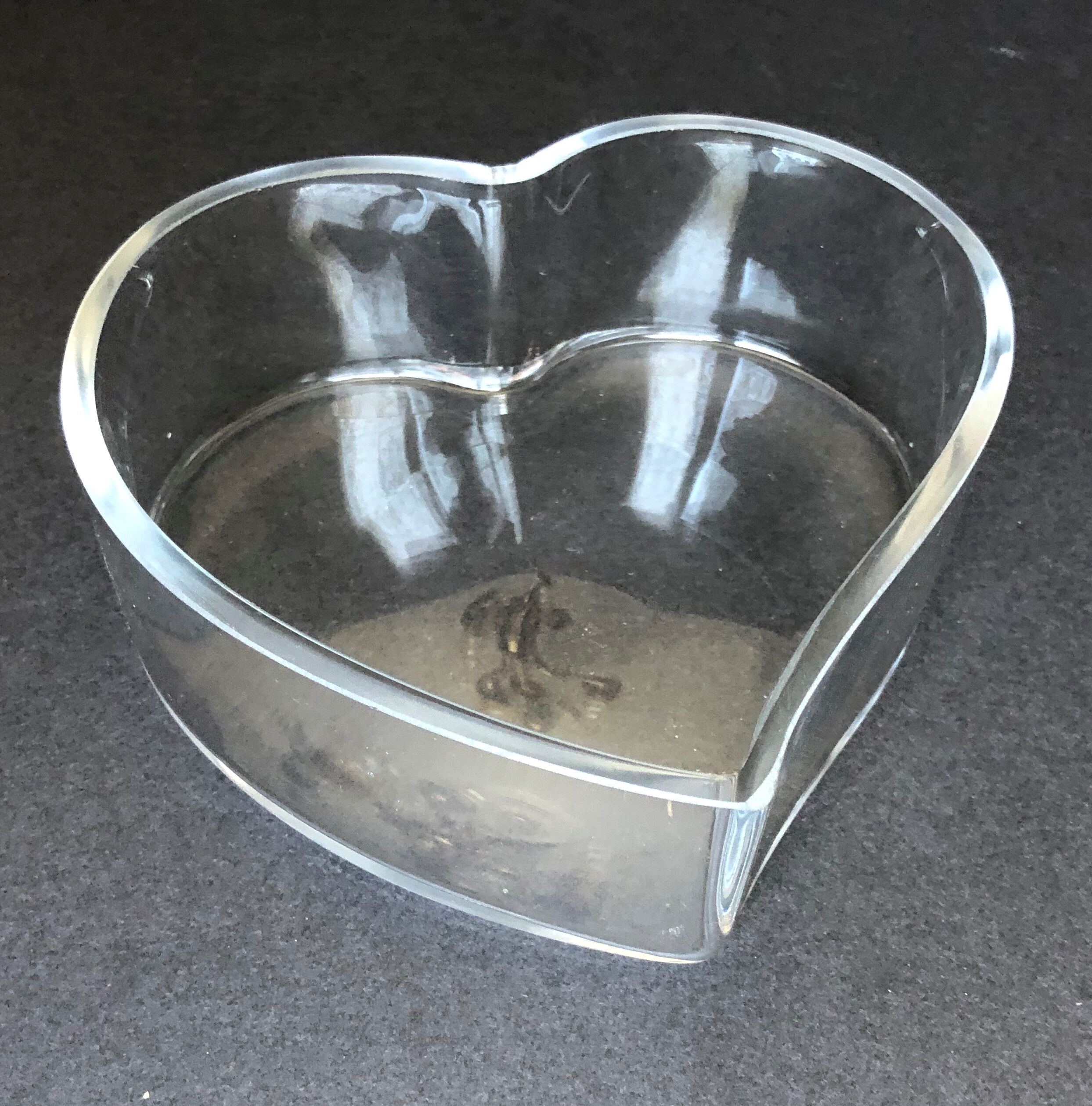 Empty glass heart-shaped pocket
