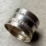 Monogrammed silver napkin ring with palmette and beaded motifs