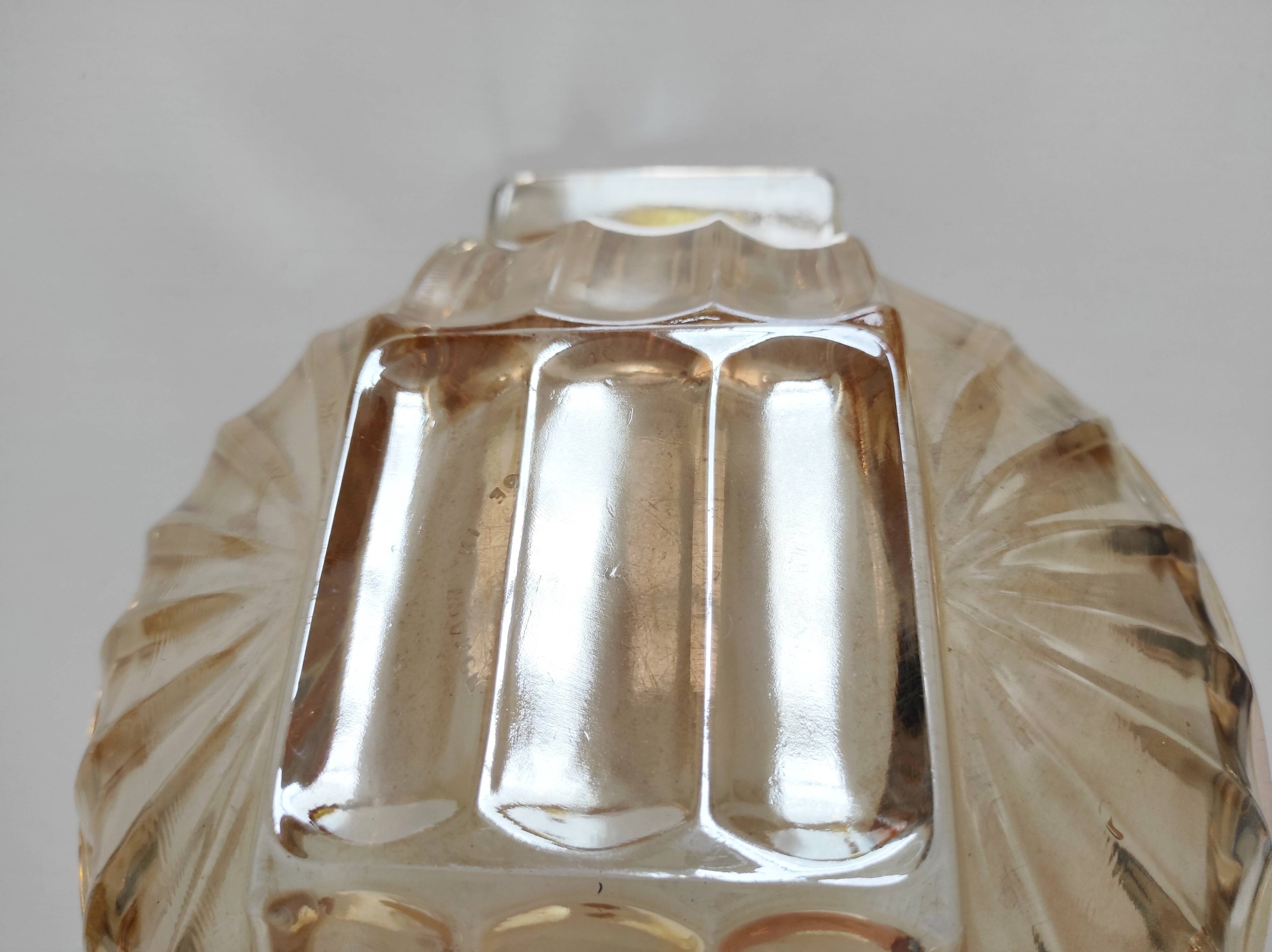 Iridescent orange glass cup