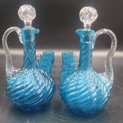 Cabaret Portieux liqueur service with 10 blue and clear glasses.