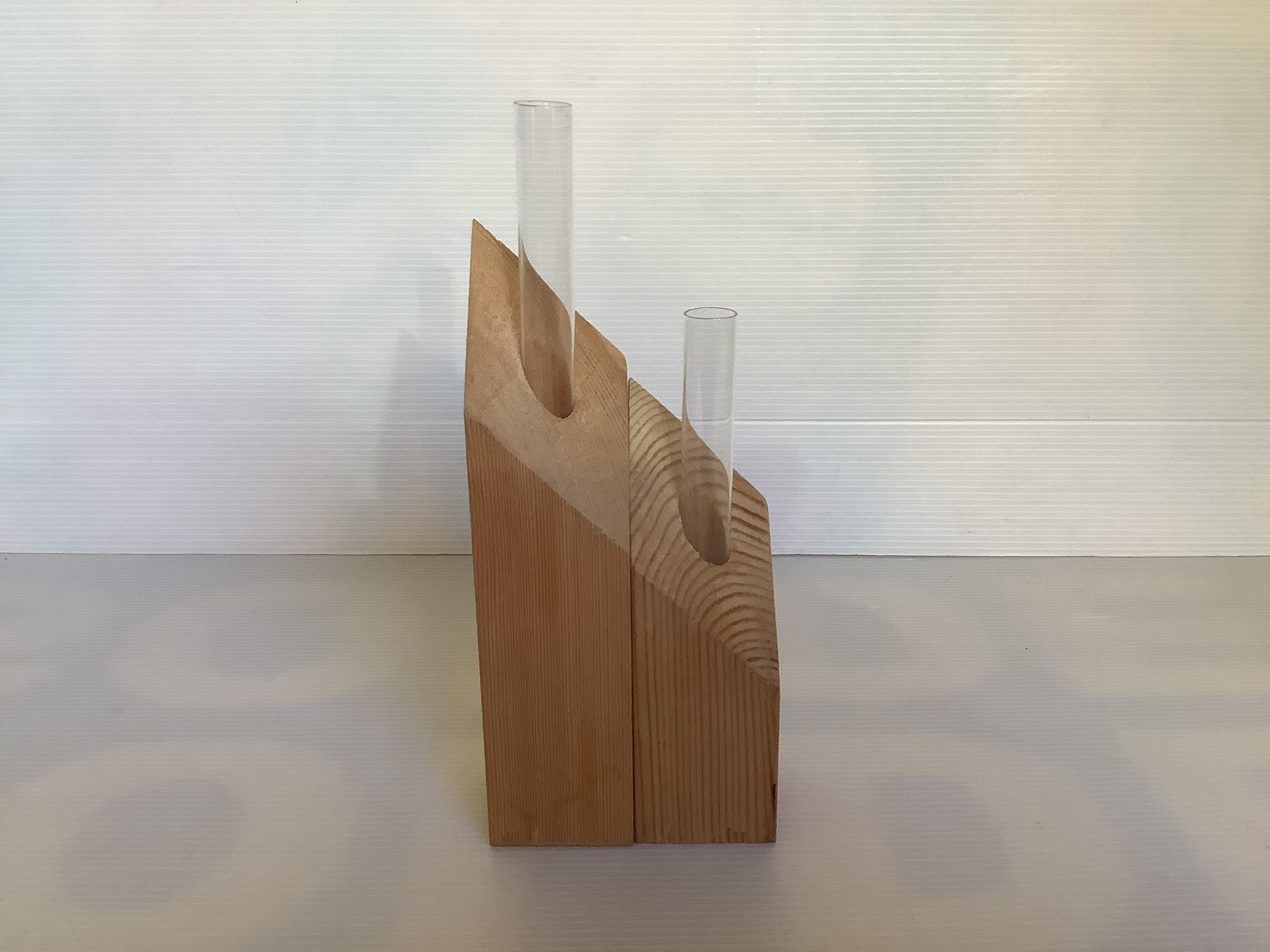 Pair of diamond-shaped wooden Scandinavian test tube vases.