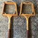 Pair of old wooden tennis rackets with 50s frames