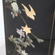 Black lacquered Chinese buffet with stone and ivory figures