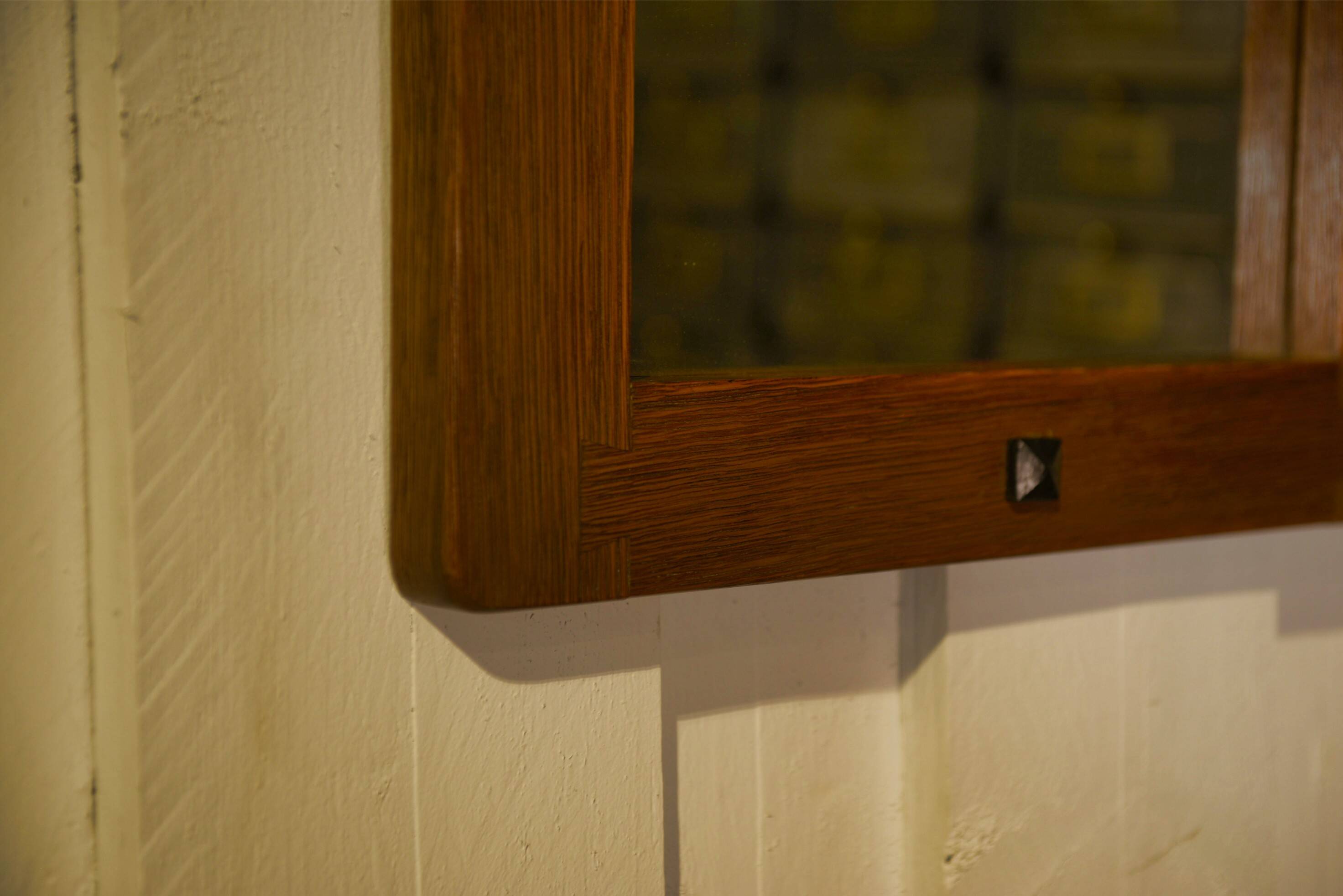 Brutalist mirror in solid oak with metal ring, 1960s.
