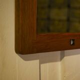 Brutalist mirror in solid oak with metal ring, 1960s.