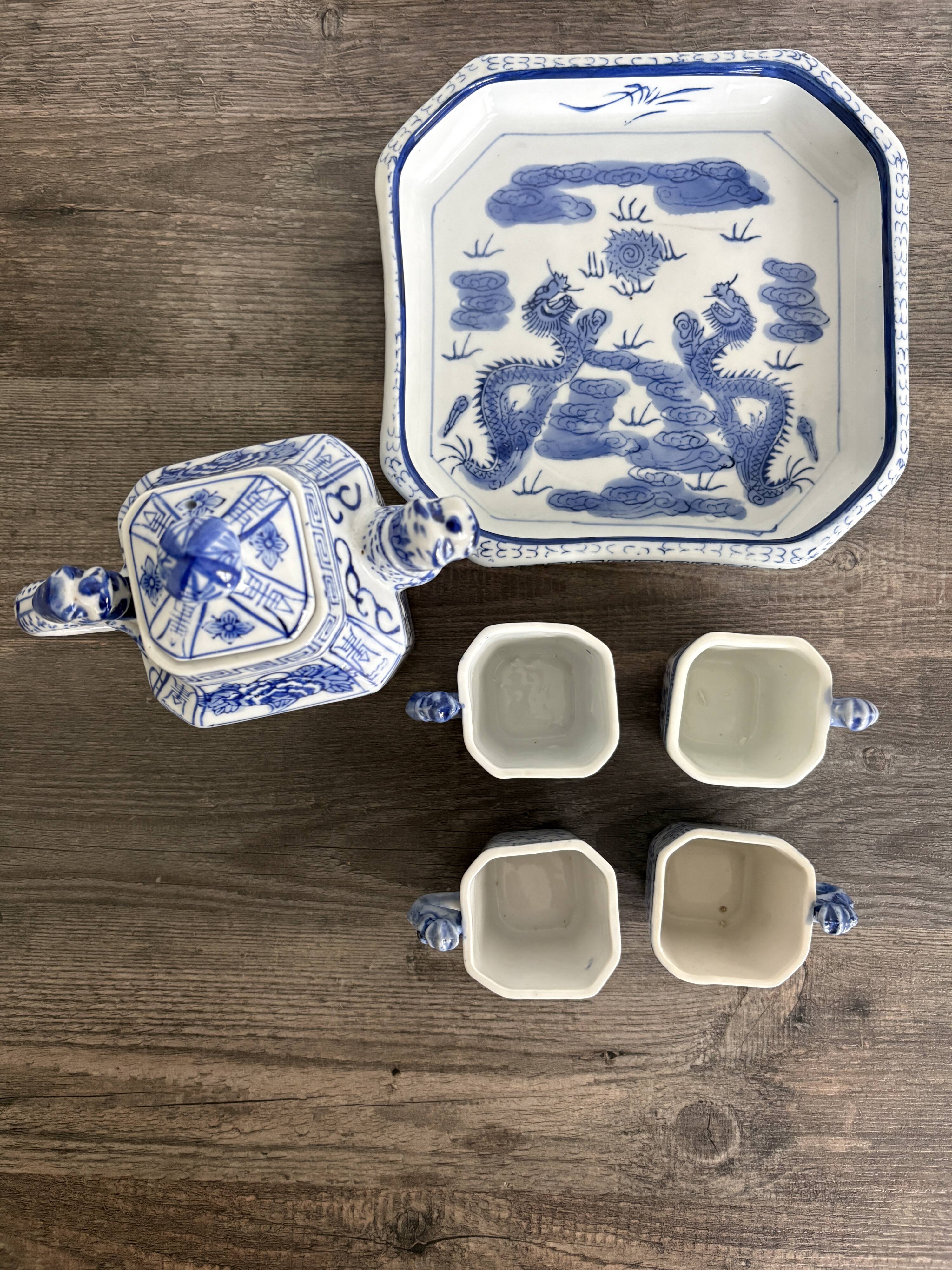 Antique Chinese tea set decorated with dragons.