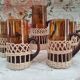 Service à citronnade 7 pièces vintage en verre ambré avec anse et contour en osier tressé