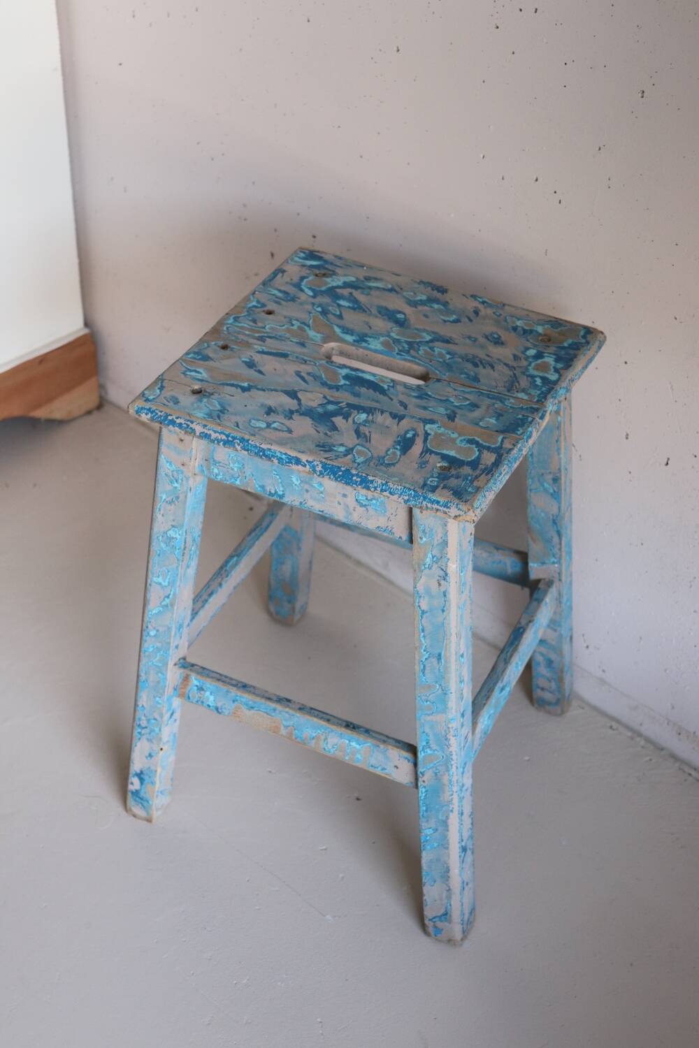 Blue patinated farm stool