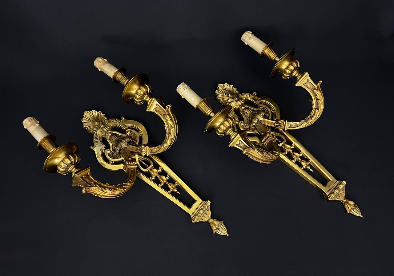 Large pair of gilt bronze wall sconces in the Louis XVI style.