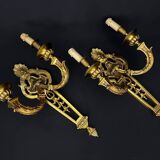 Large pair of gilt bronze wall sconces in the Louis XVI style.