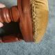Upholstered stool on casters