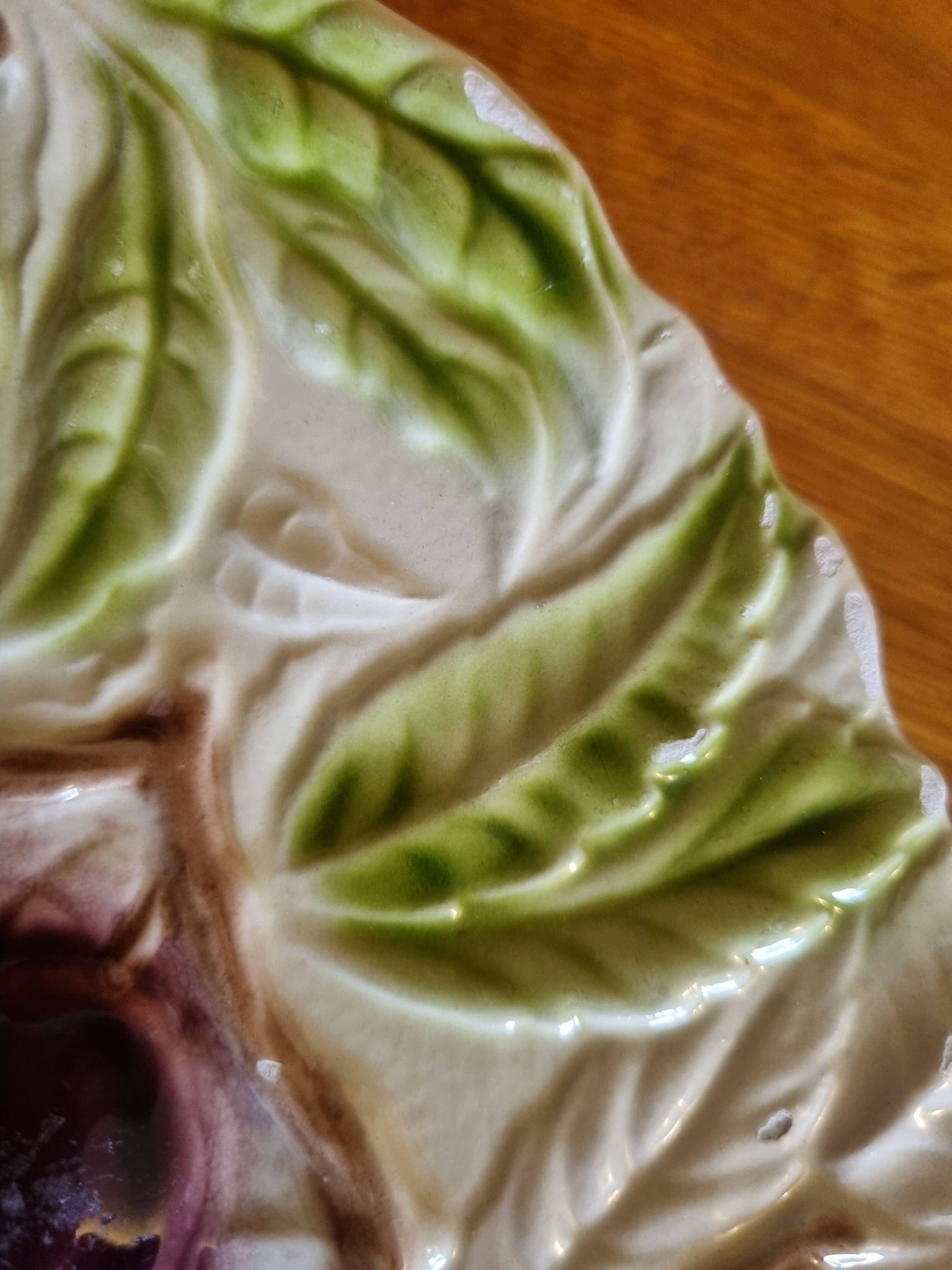 Large vintage earthenware dish with a fruit pattern.