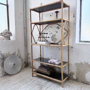 Rattan bookshelf and black glasses