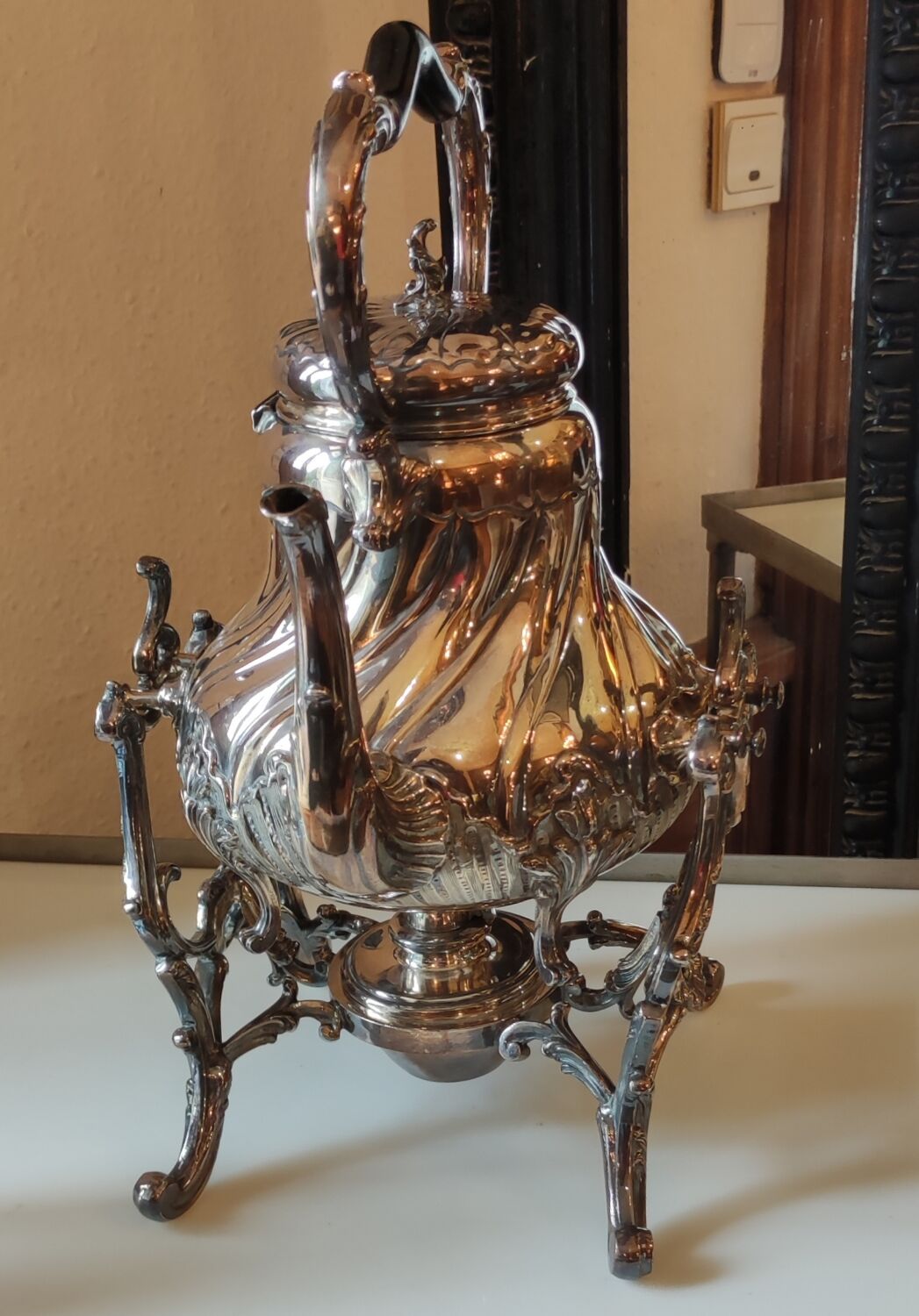Ancient samovar tea fountain in silver metal