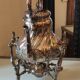 Ancient samovar tea fountain in silver metal