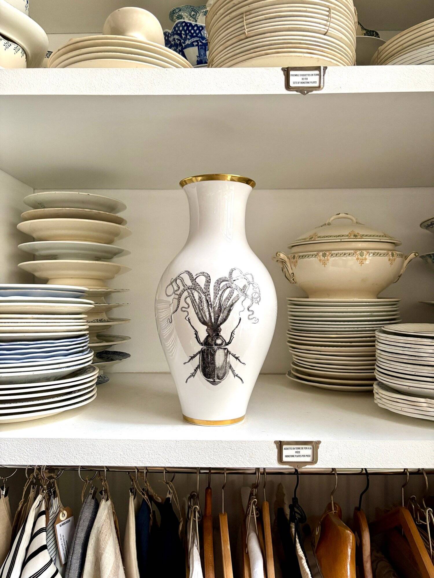 White and gold porcelain vase with black patterns by Mauricio Ortiz