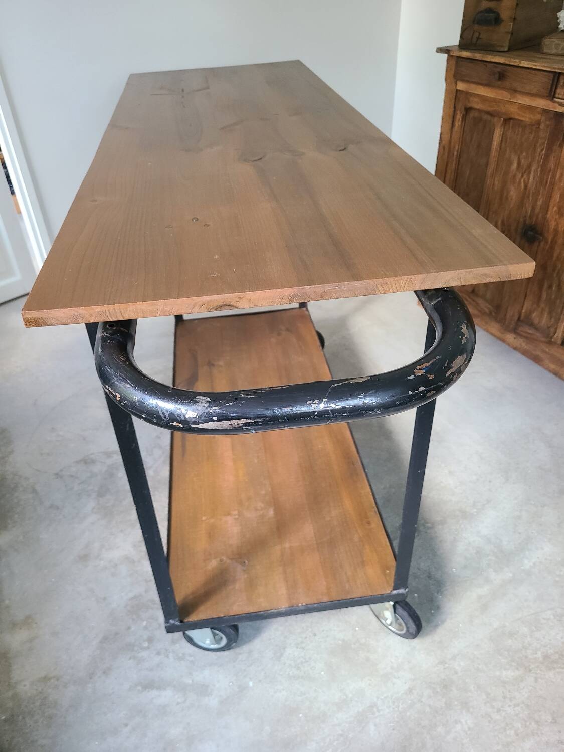 Large central kitchen island trolley on wheels serving industrial console