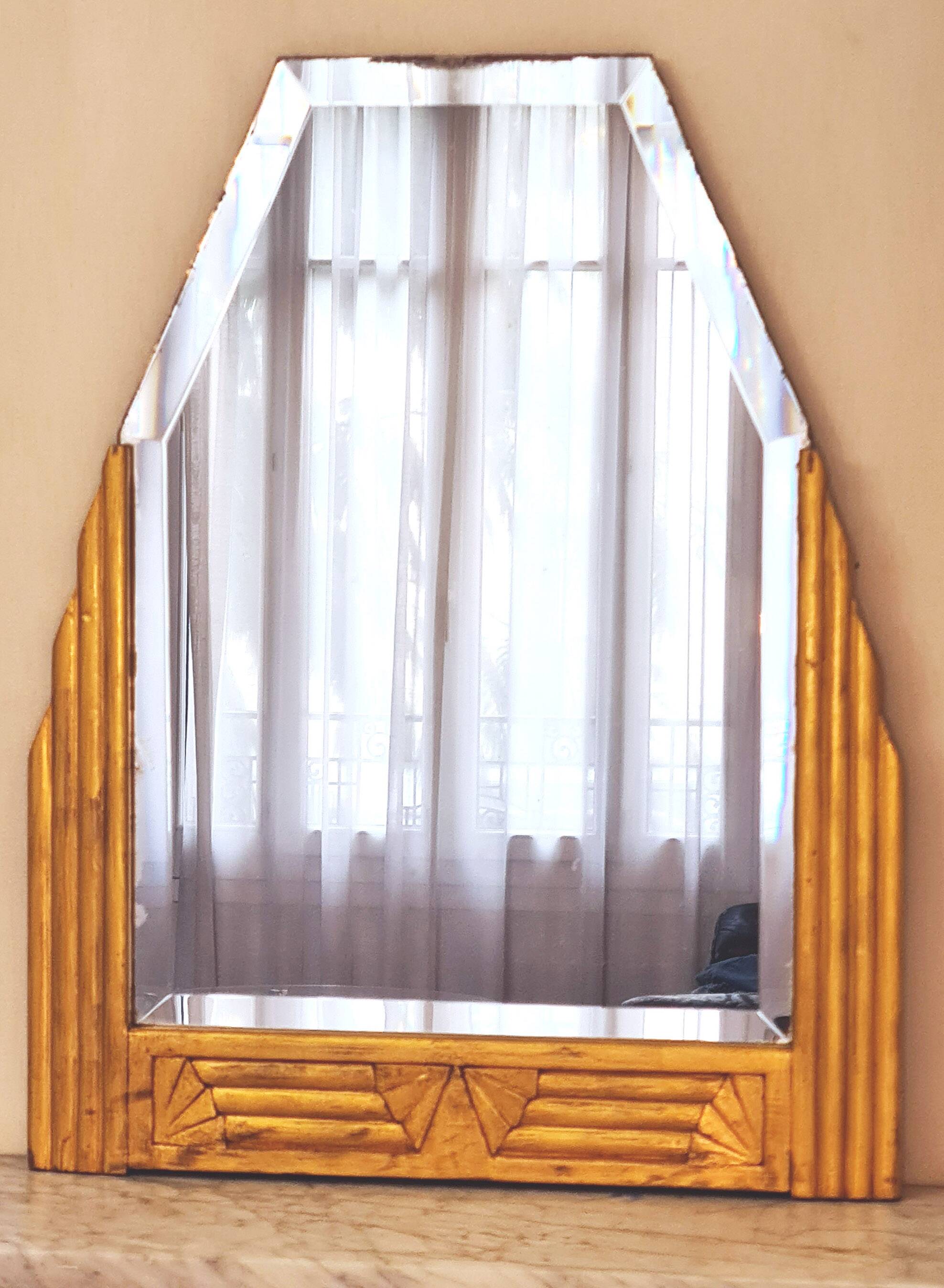Antique Art Deco mercury mirror, in carved wood with gold leaf.