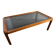 Large Scandinavian coffee table in teak and smoked glass.