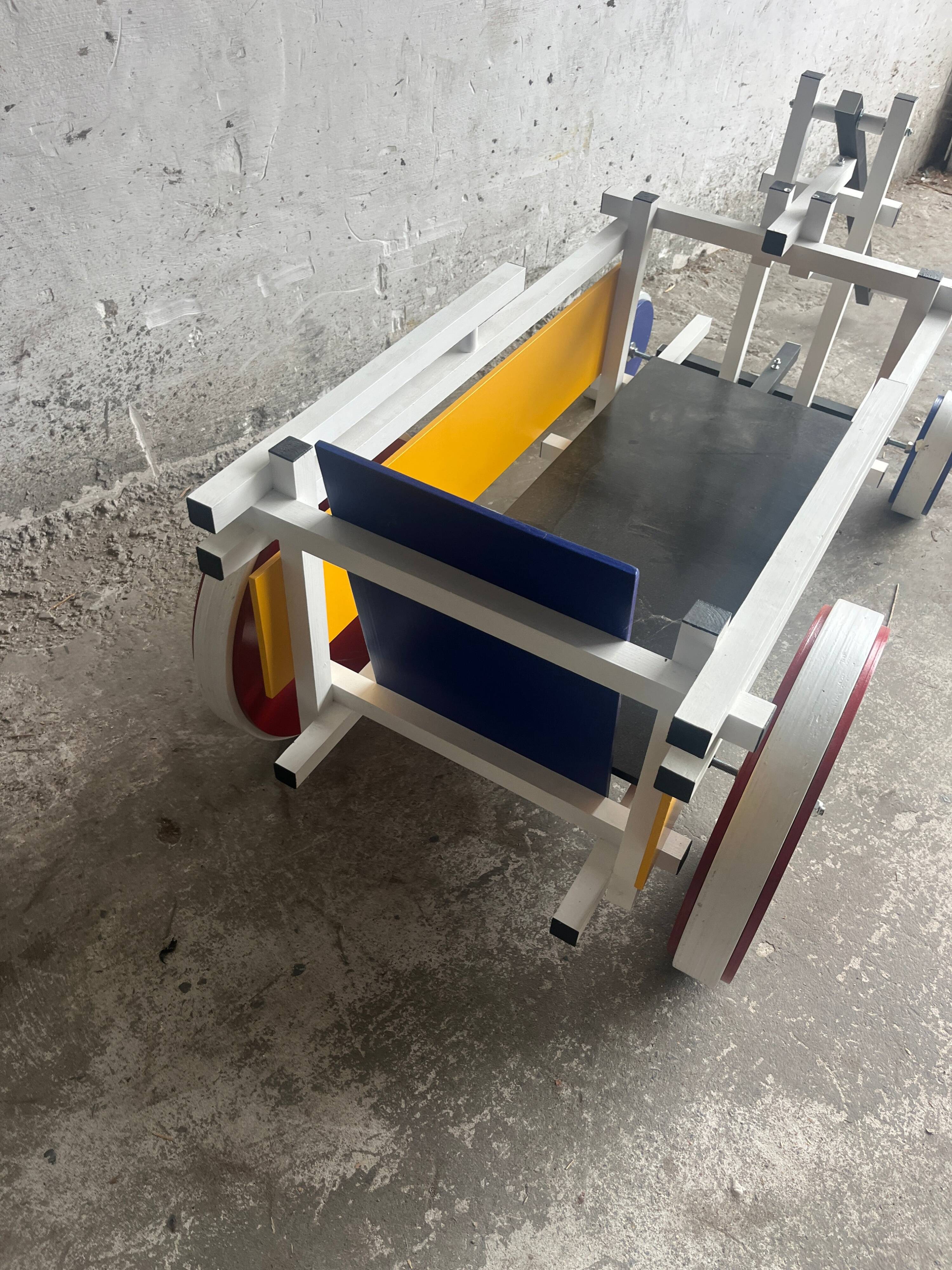 Rietveld-style De Stijl handcart in painted wood — white frame with red, blue, yellow accents