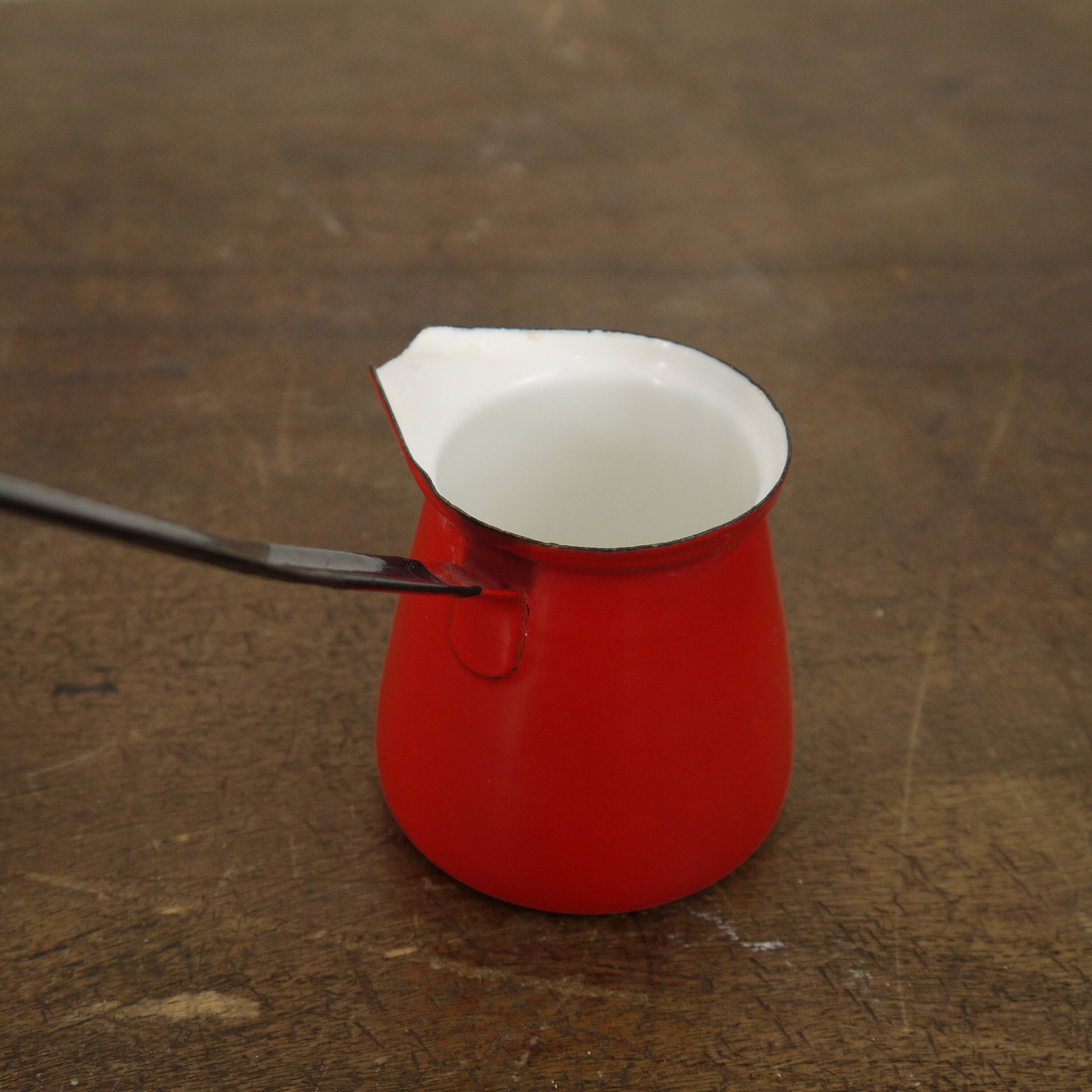 Turkish coffee maker in red enamel