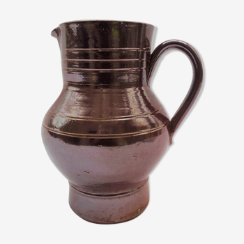 Pitcher in brown sandstone