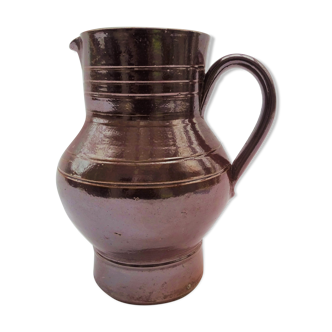 Pitcher in brown sandstone