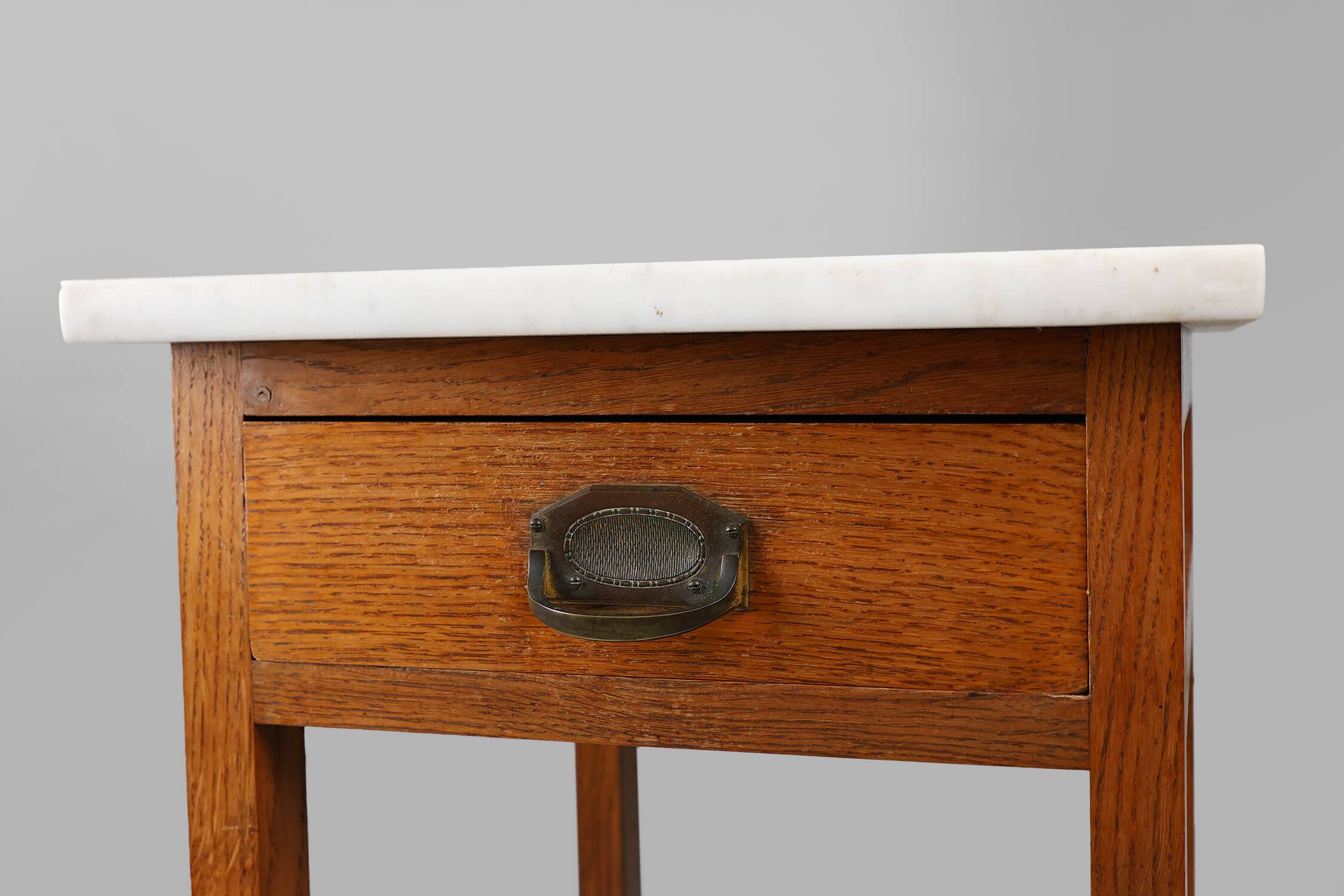 French Art Deco bedside table with a Carrara marble top, circa 1920.