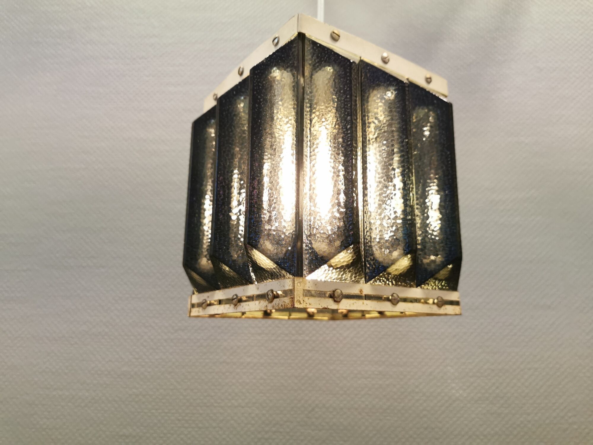 Old Swedish lamp made of metal and smoked solid glass pieces.