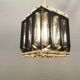 Old Swedish lamp made of metal and smoked solid glass pieces.