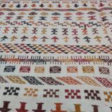 White carpet with multicolored Berber patterns
