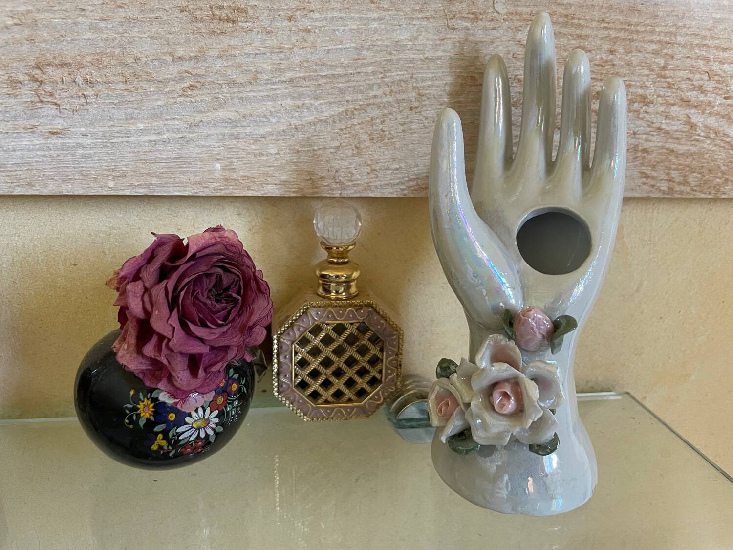 Hand holds jewelry or soliflore