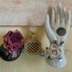 Hand holds jewelry or soliflore