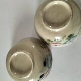 Two large vintage bowls in pastel decor on mini pedestals.
