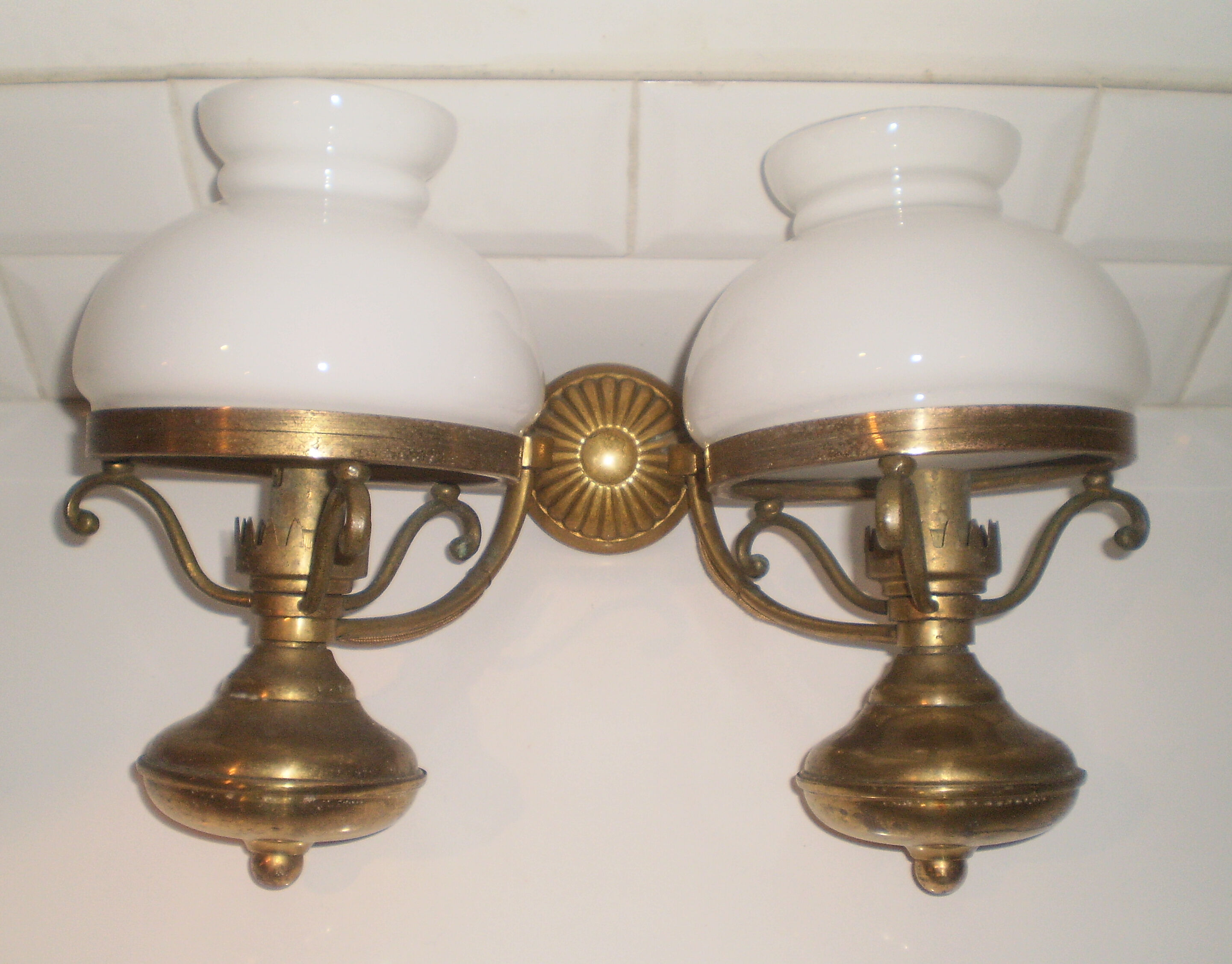Glass brass globe sconce