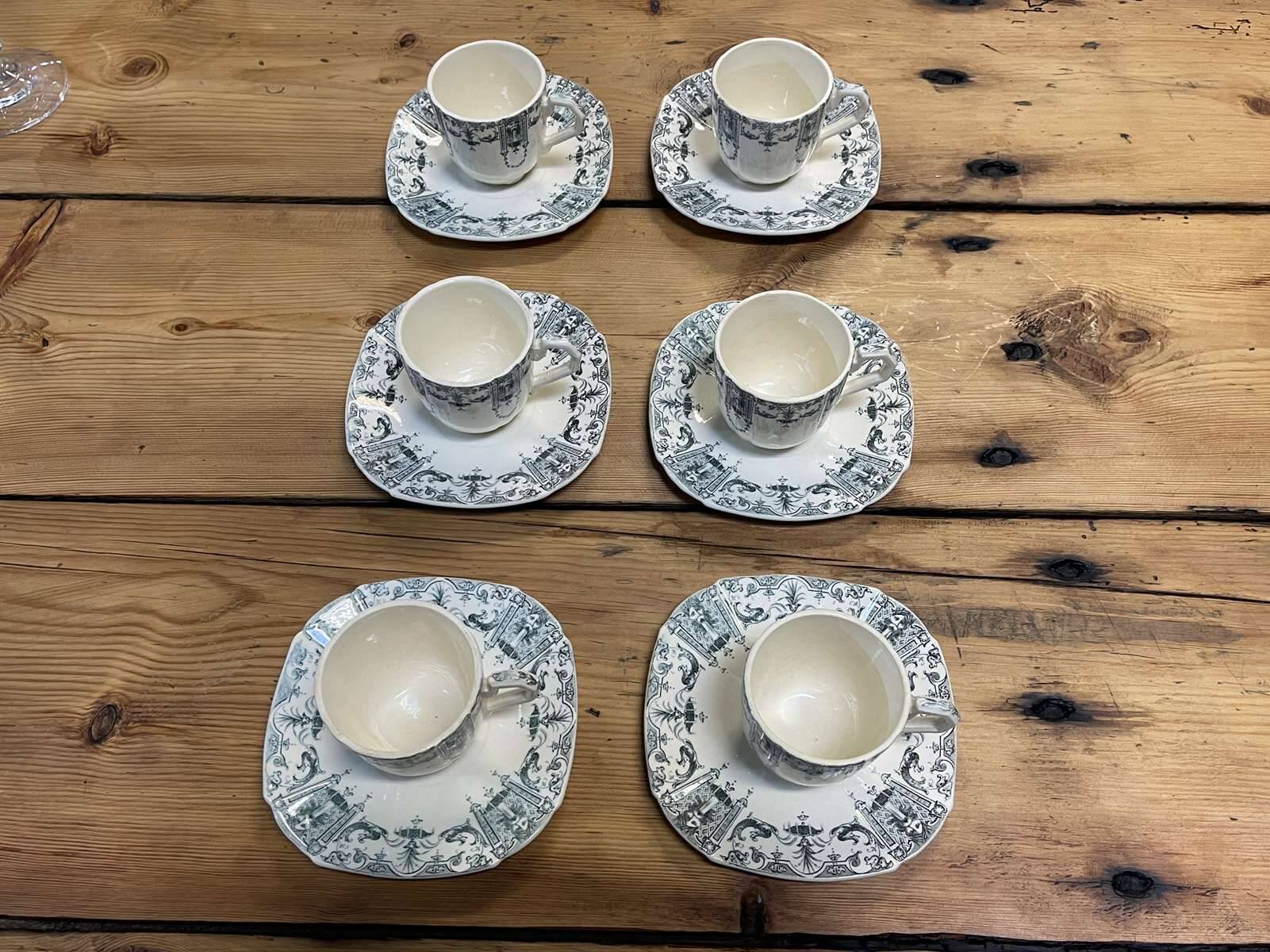 6 cups and saucers in Gien earthenware with Mascaron decoration from the early 20th century.