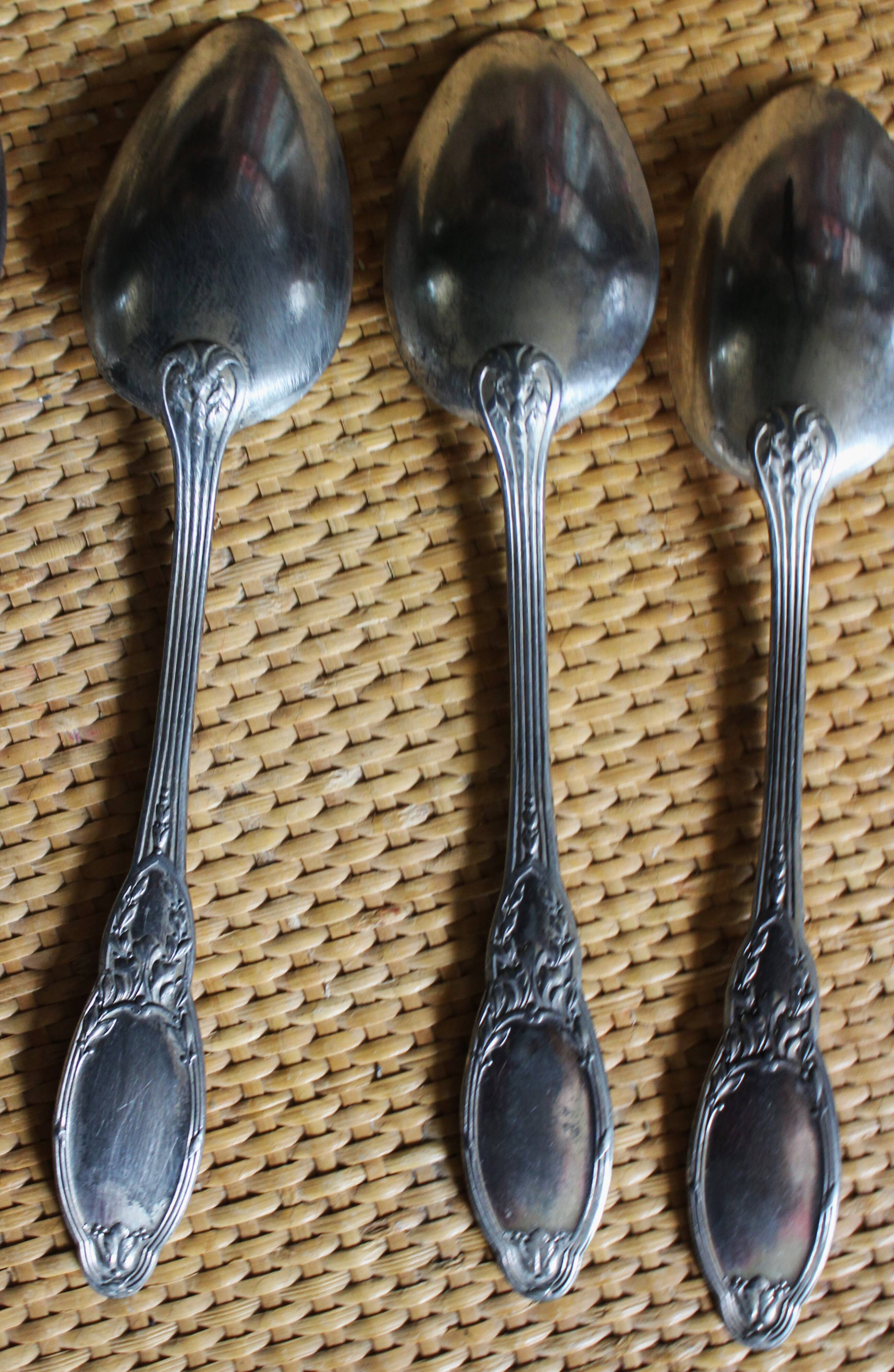 One of 6 silver-plated leafy metal soup spoons