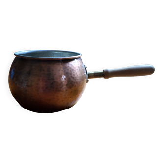 Copper pan with a wooden handle hammered by hand