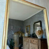Antique gilded mirror with pearl and gold leaf.