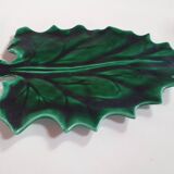 empty green ceramic pocket cup, small chips on the edges, signed