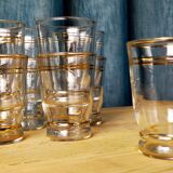 Set of 9 old glasses with golden net