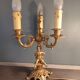 Electrified three-spoke brass candlesticks
