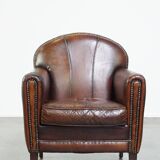 Characterful vintage design armchair made from beautifully patinated sheepskin