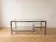 1970s Roméo Rega coffee table in glass and chrome metal.