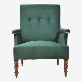 Armchair in green velvet