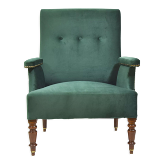 Armchair in green velvet