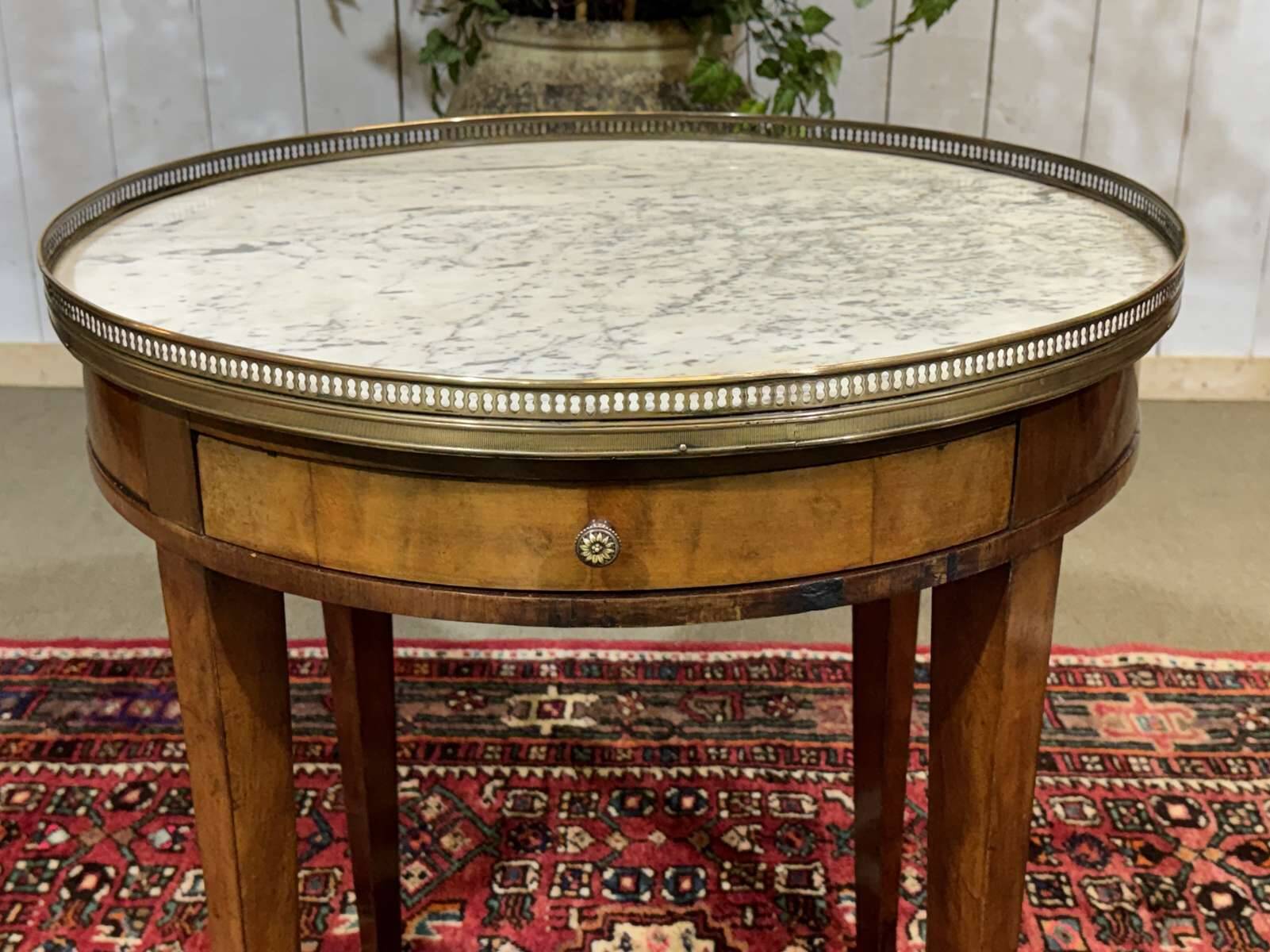 Louis XVI style bouillotte table in mahogany with a white marble top.