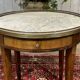 Louis XVI style bouillotte table in mahogany with a white marble top.