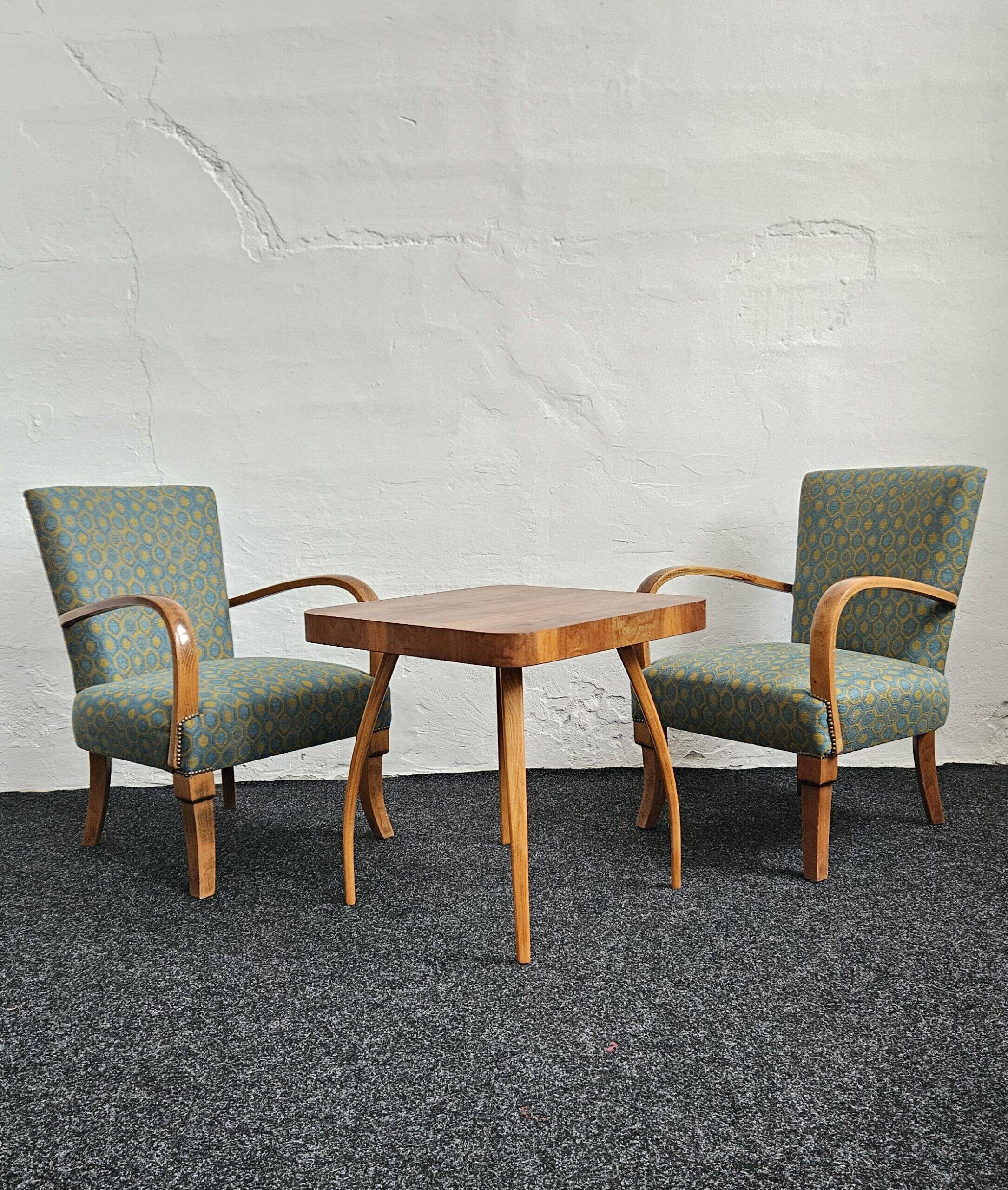 Halabala “Spider” coffee table and Hungarian late Art Deco armchairs, 1950s